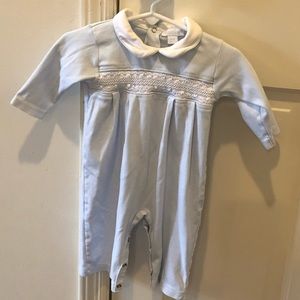 Kissy Kissy smocked blue romper.